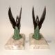 Art Deco bookends with metal swans, double patina and marble base.