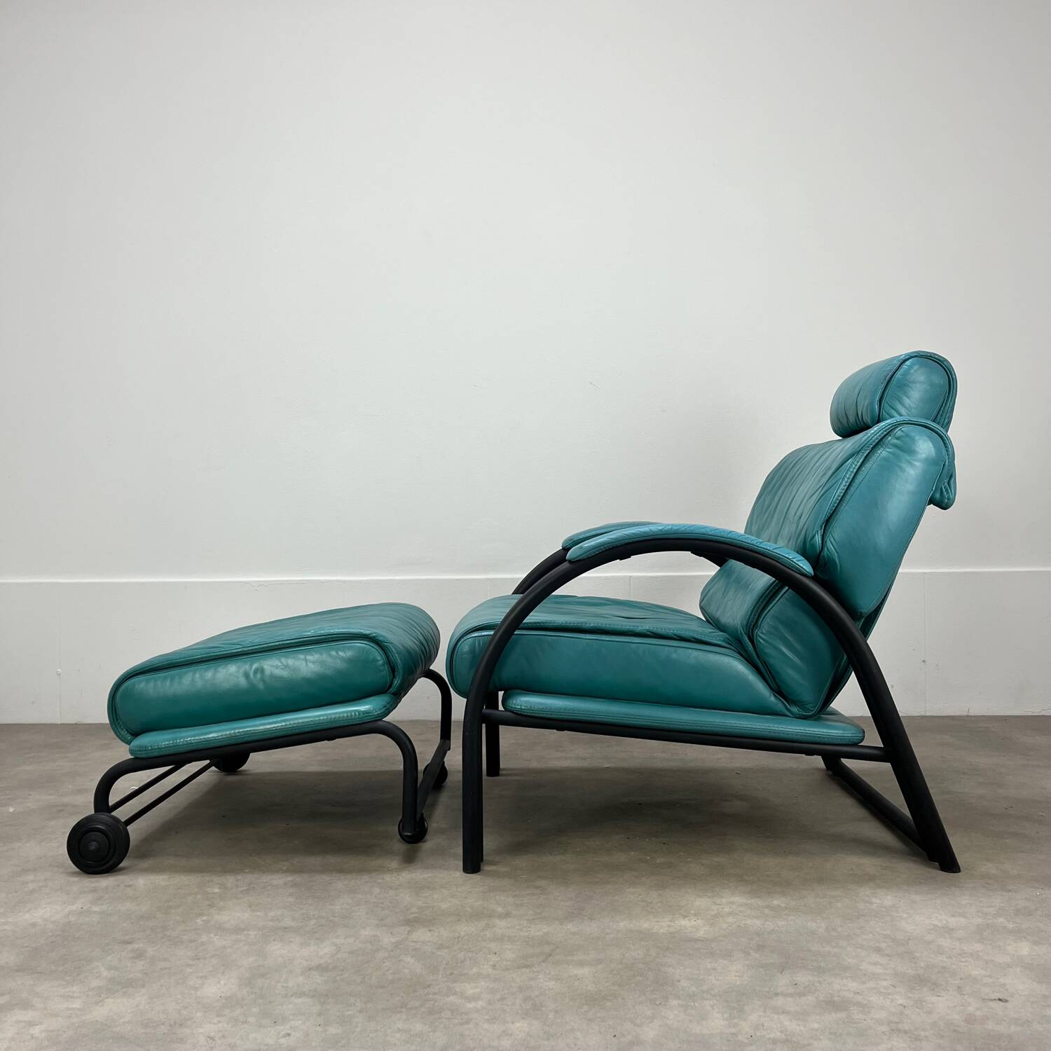 Postmodern design armchair and ottoman, 80s leather