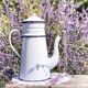 Old coffee maker in enamelled sheet metal