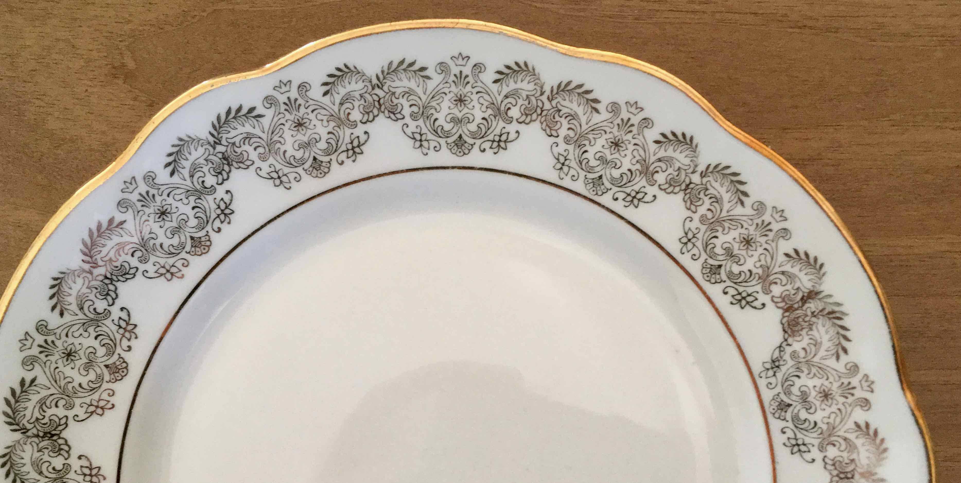 8 white and gold porcelain dessert plates