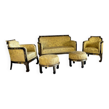 A set of two armchairs, a sofa and two poufs in lacquered wood with gilded chinoiserie decoration.