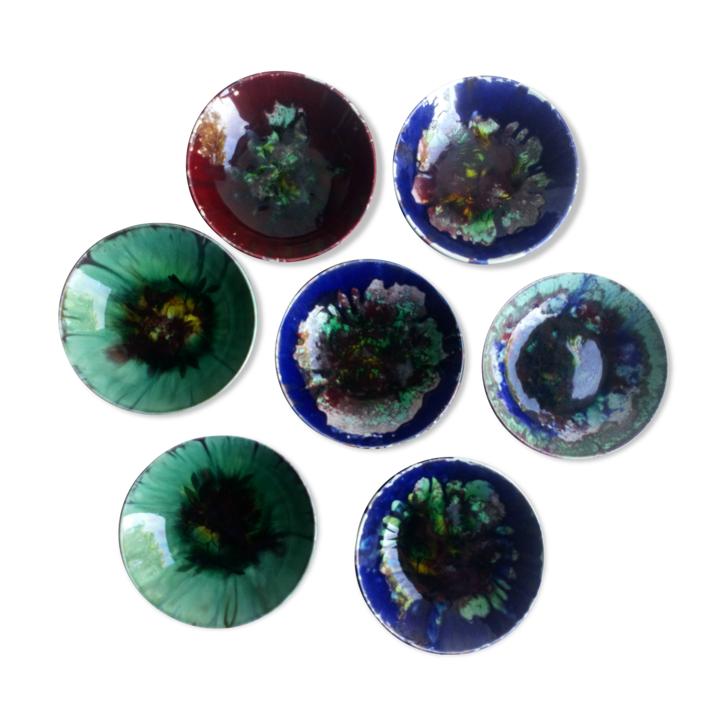 Seven plates of potter with multicolored enamels