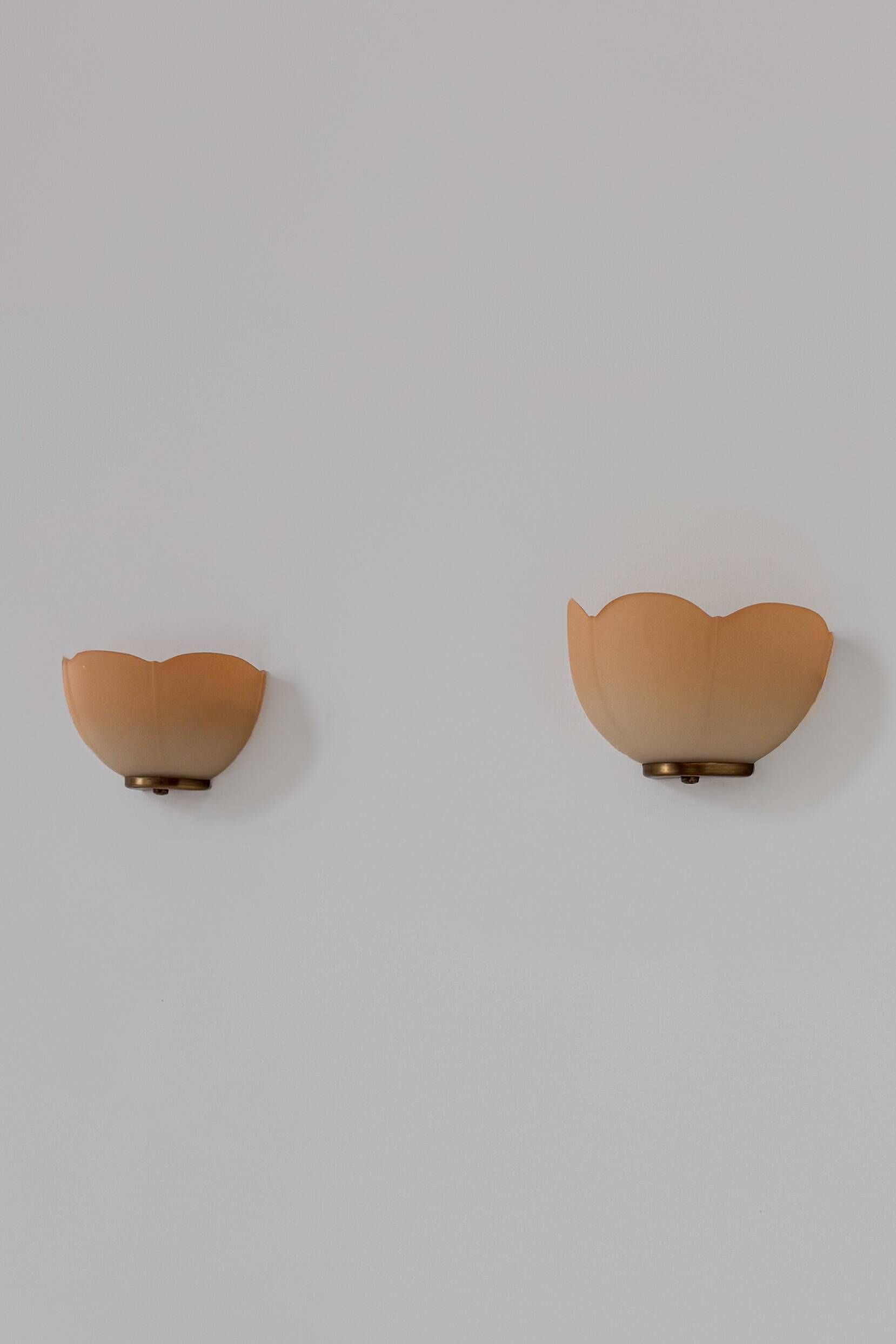Vintage brass and orange glass wall sconces, France 1970.