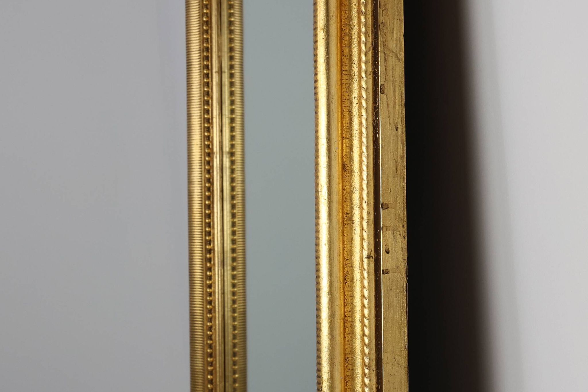 Baroque mantel mirror in carved wood and gilded plaster, France circa 1850.