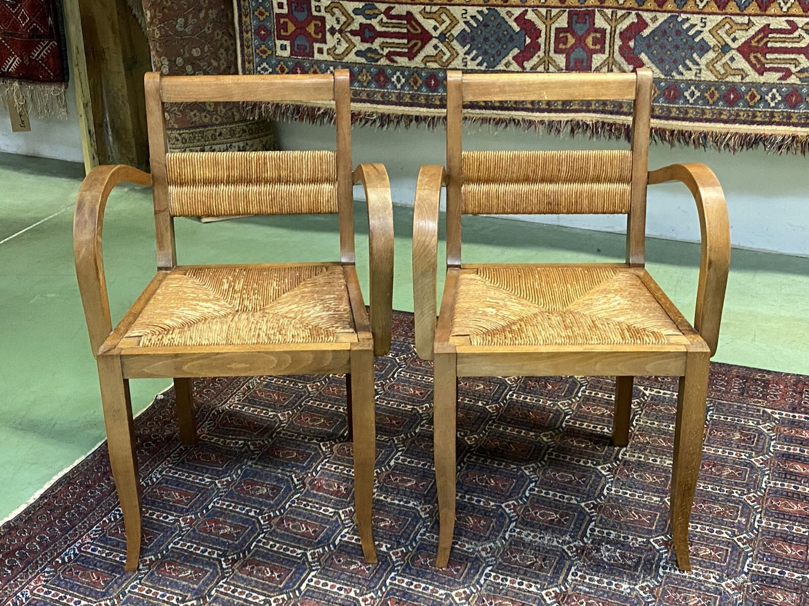 Pair of beech and straw armchairs