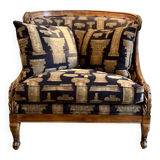 Armchair in a wooden confessional style with black and beige cotton.