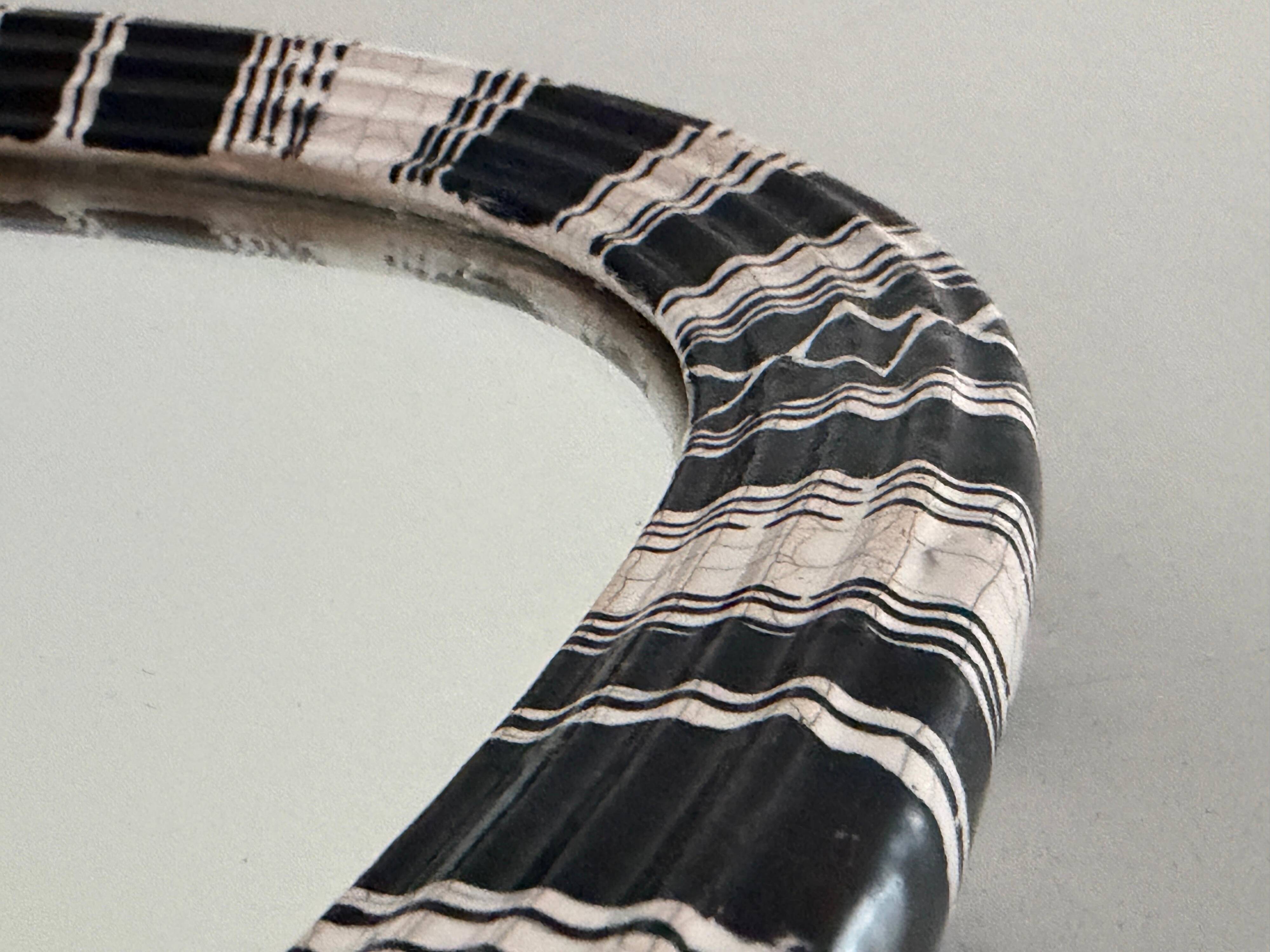 Small wall mirror, round triangle in black and white ceramic, 1950s, Germany.