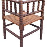 Old corner straw armchair in turned wood