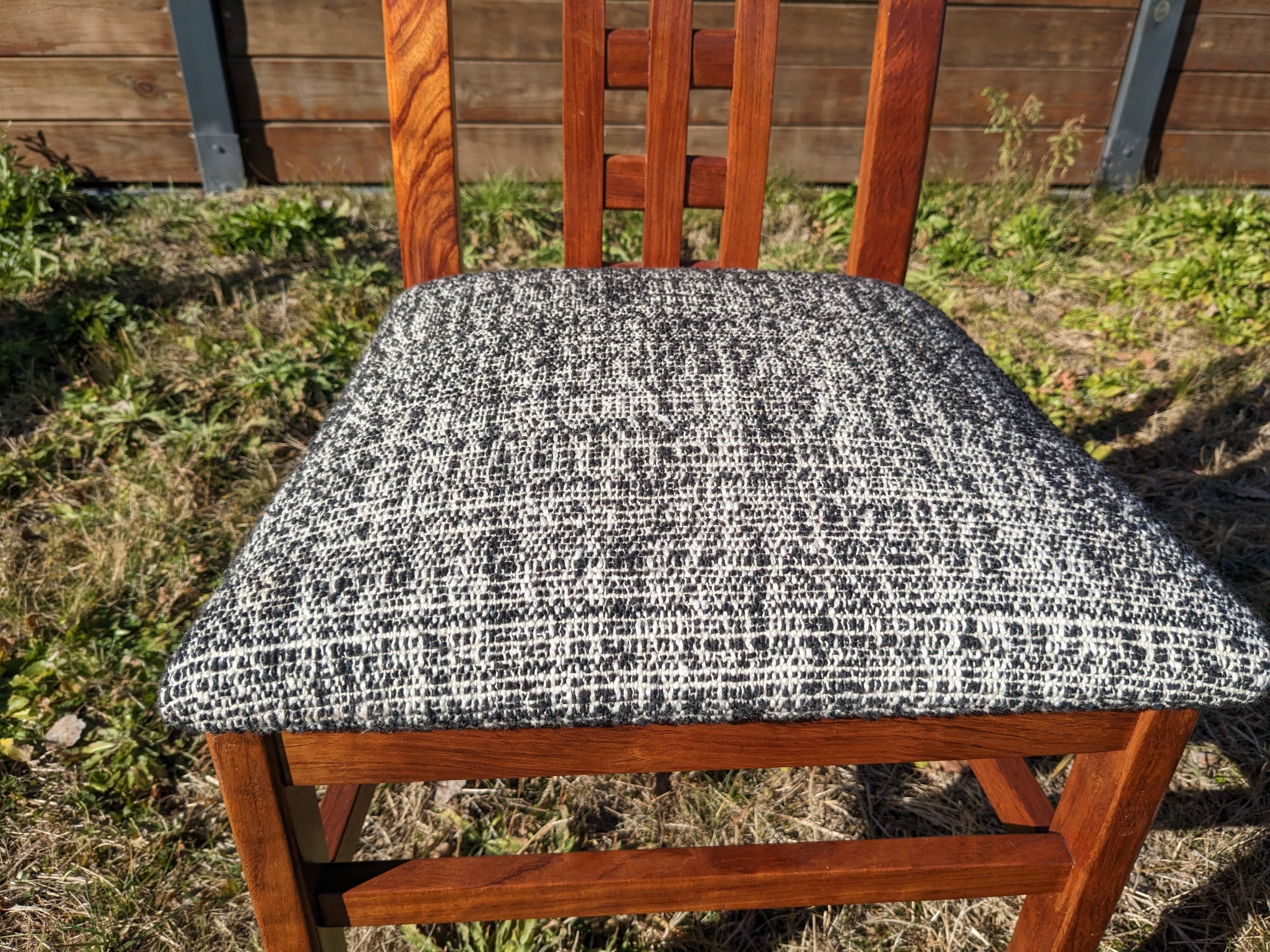 Set of 8 teak lounge chairs with high backs and zebra-striped seats
