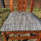 Set of 8 teak lounge chairs with high backs and zebra-striped seats