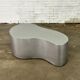 Table basse en acier inoxydable de forme organique