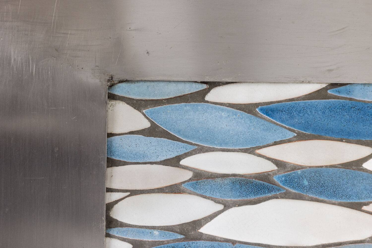 Polished metal and ceramic dining table. 1970s.