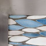 Polished metal and ceramic dining table. 1970s.