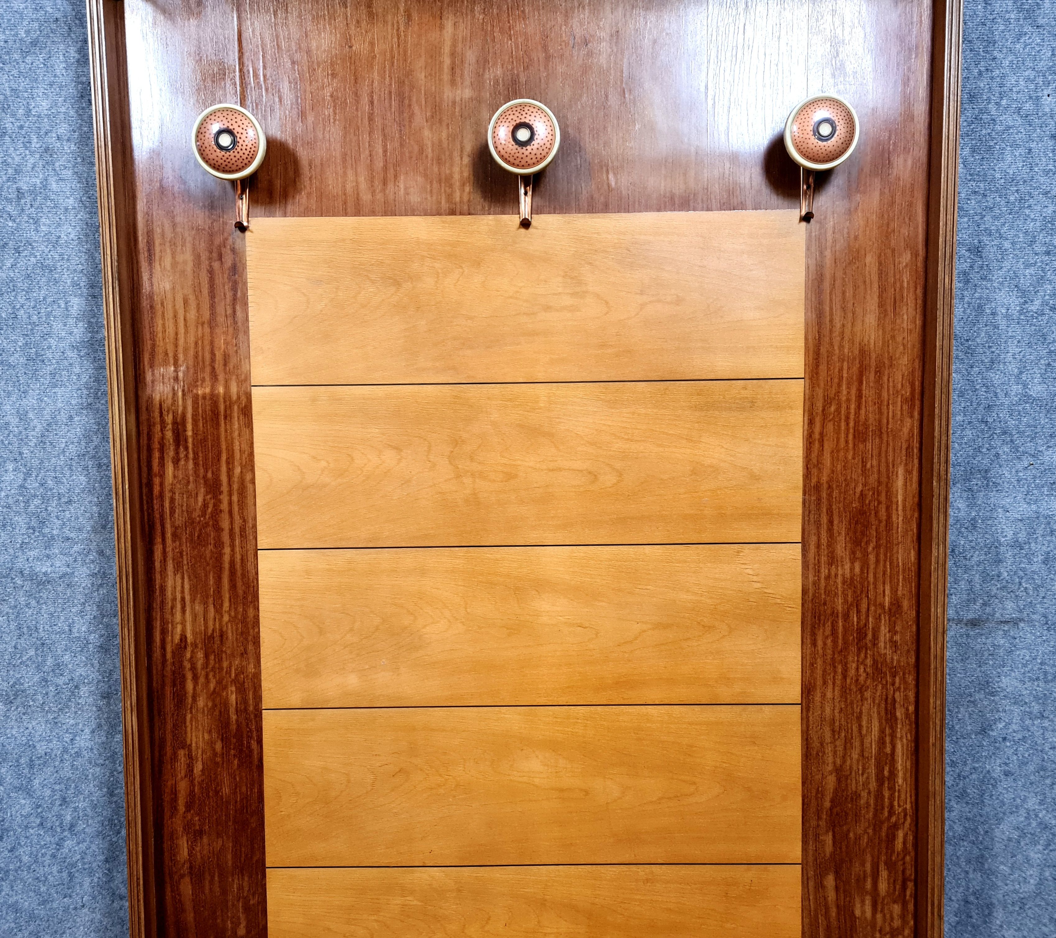 Art deco period coat rack in mahogany and light wood around 1940