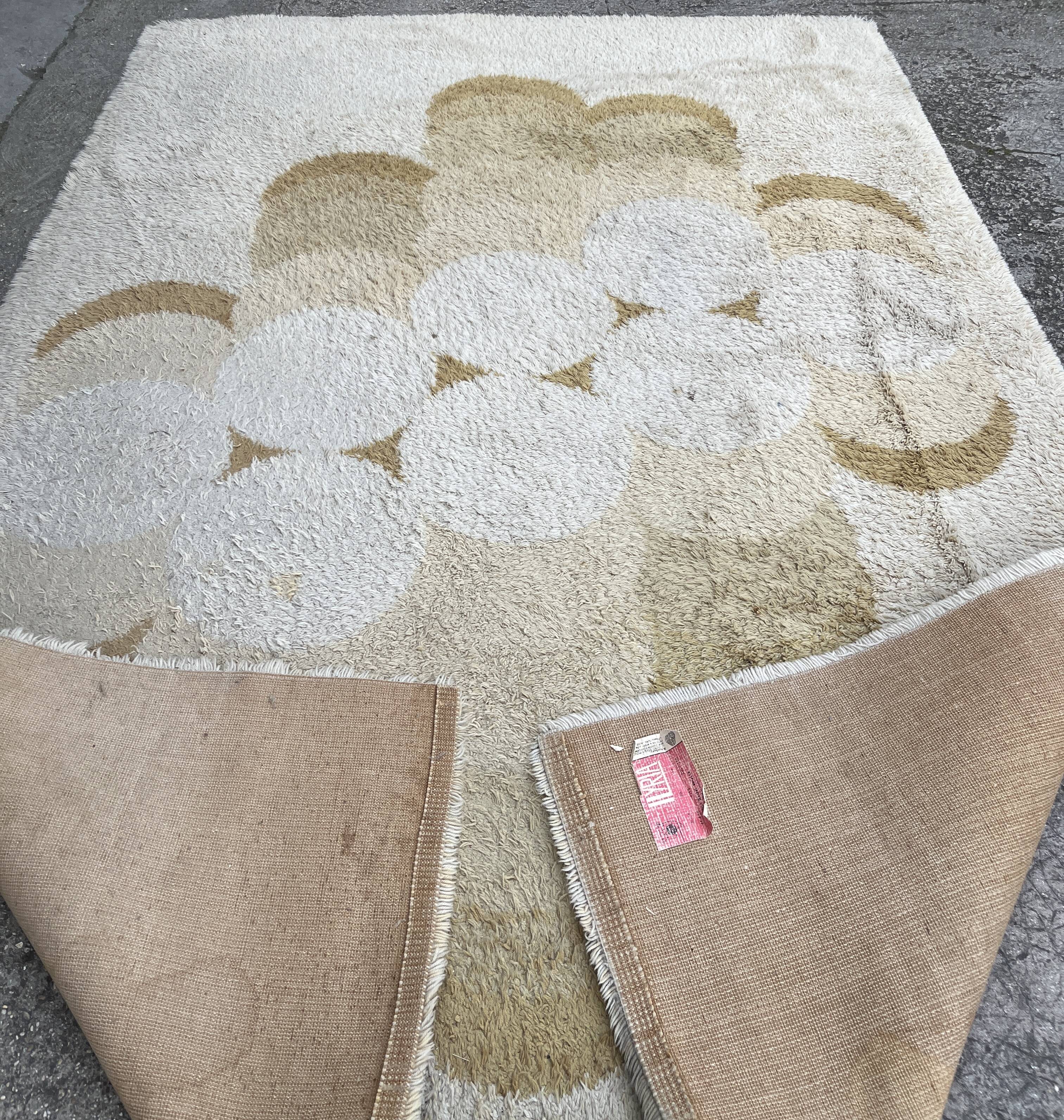 Large rug with floral decoration.