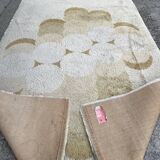 Large rug with flower decoration.