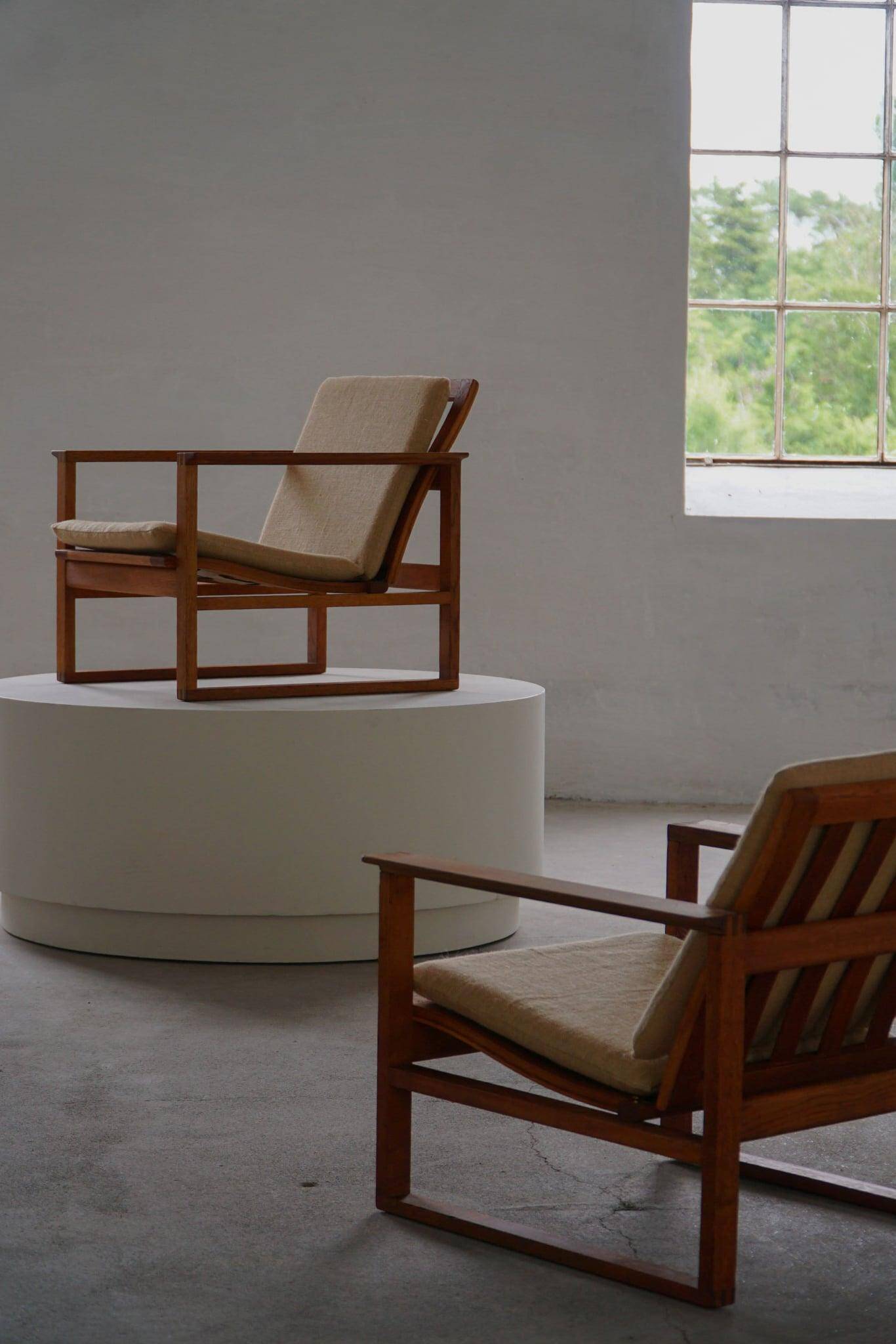 Børge Mogensen, a pair of BM2256 lounge chairs in oak and jute, Denmark, 1960s.