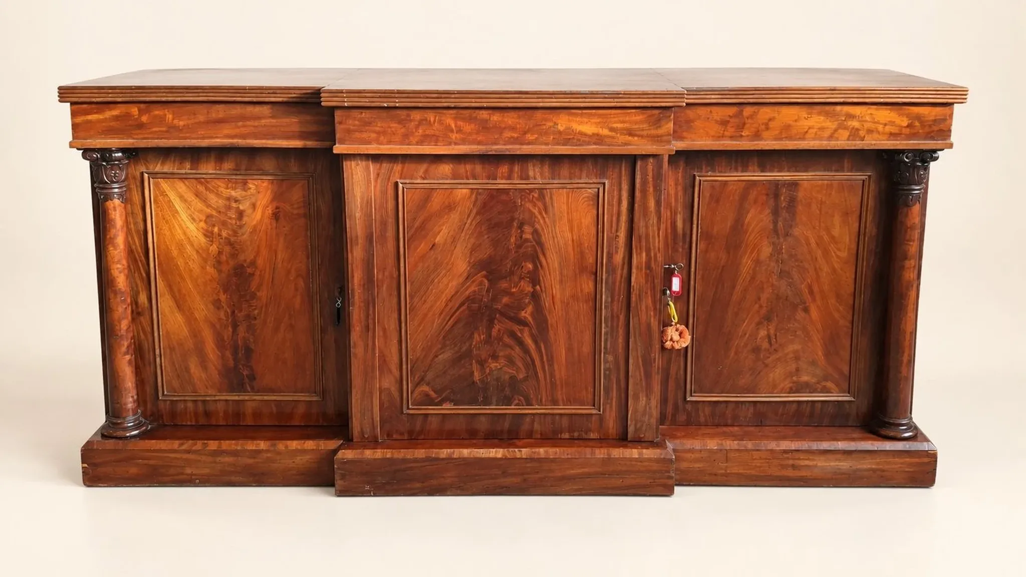 Large buffet in flame mahogany, William IV / Regency columns.