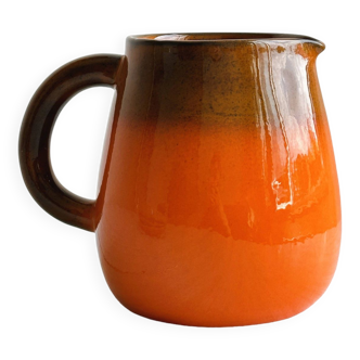 Orange ceramic pitcher
