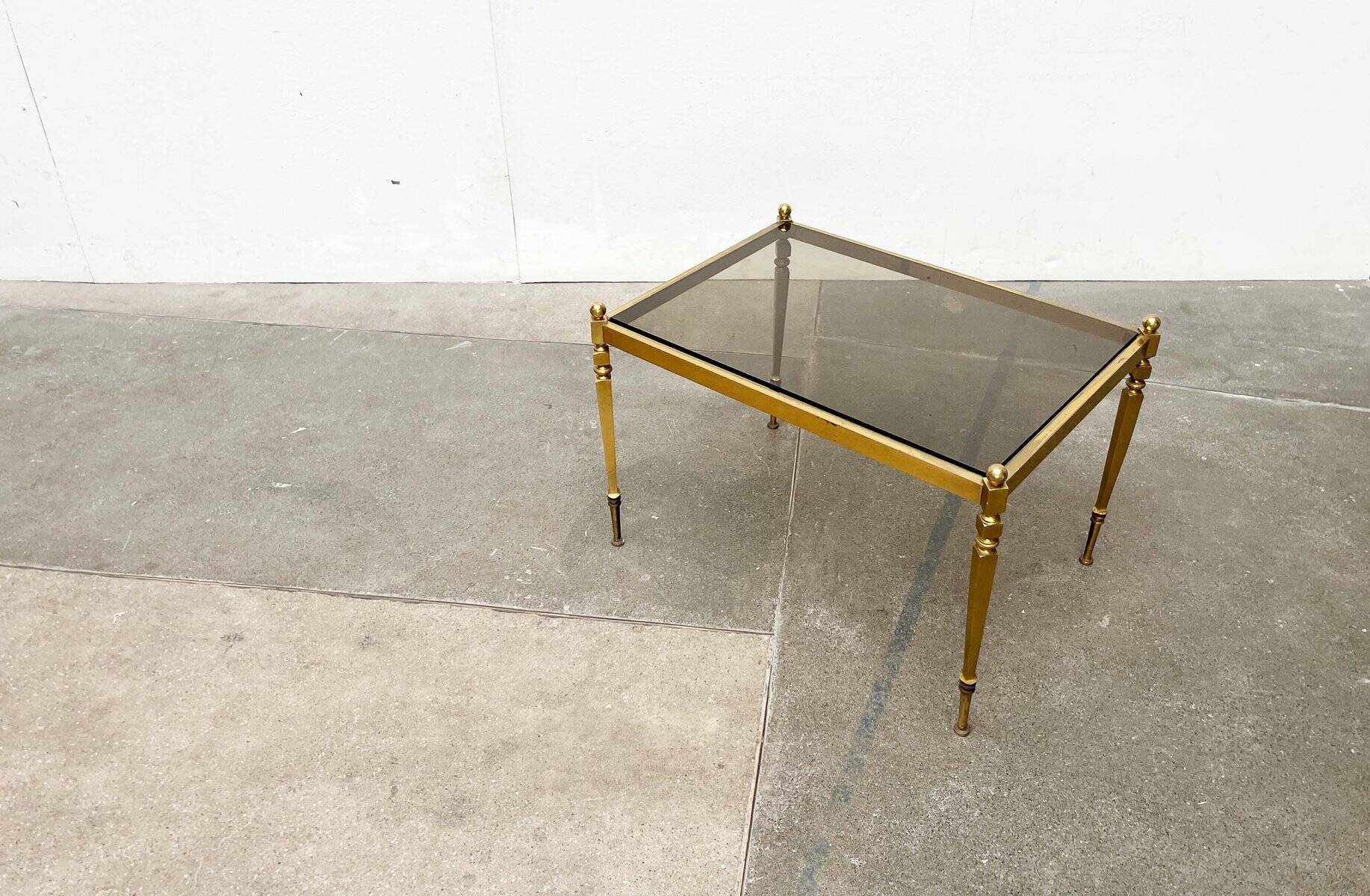 Mid-century German Hollywood neoclassical brass and glass side table from the 1950s.
