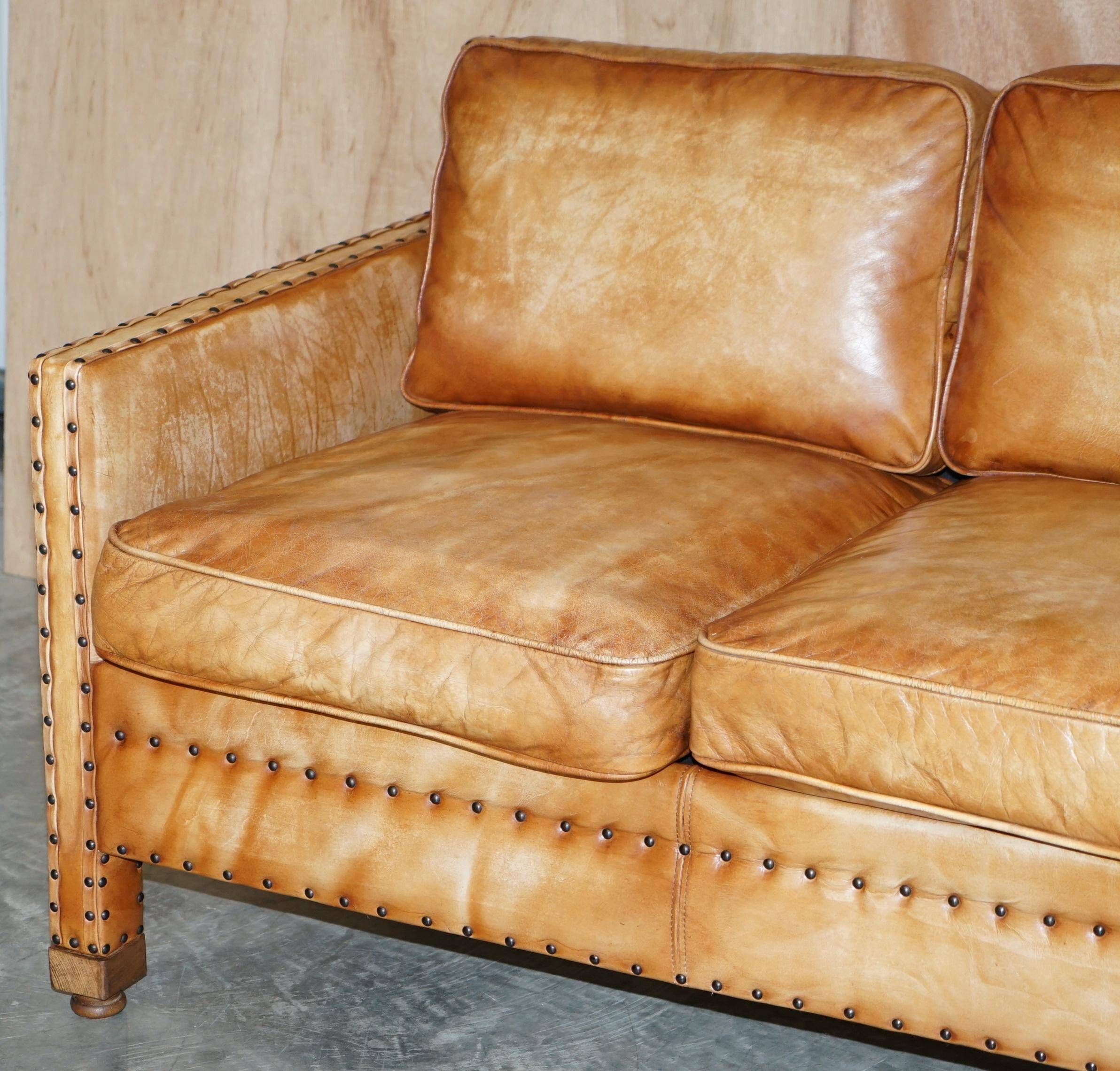 Two-seater leather canapé, hand-tanned, Edwardian style with studs.