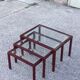 Nesting tables in burgundy lacquered metal and brass, France 1950s