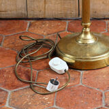 Articulated brass floor lamp