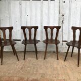 4 wooden chairs with brutalist design