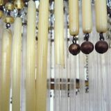 Art Nouveau style bronze chandelier with yellow and mauve pendants, 11 lights. 1960s