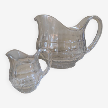 2 old glass pitchers
