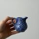 Old cream milk jug in slip