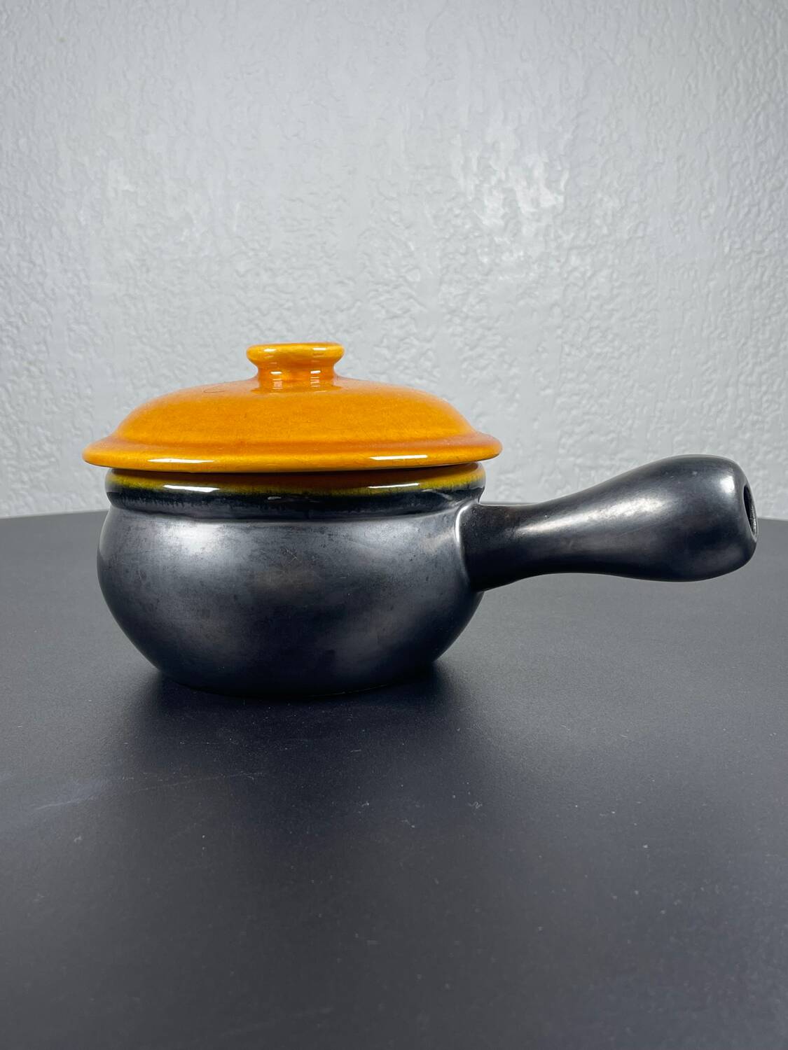 Black and yellow fondue pot