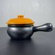 Black and yellow fondue pot
