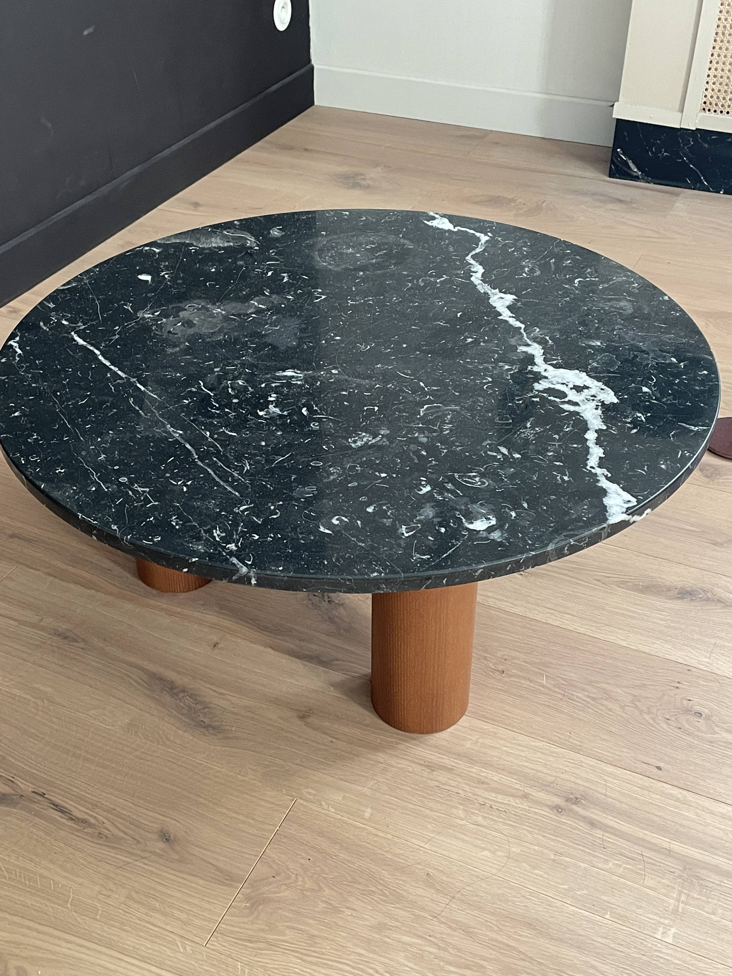 Black marble coffee table with wooden legs