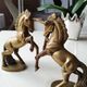 of greenhouse art deco bookends recancing unicorns. solid brass