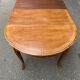 Round extendable dining table Louis XV in solid wood from the 1960s.