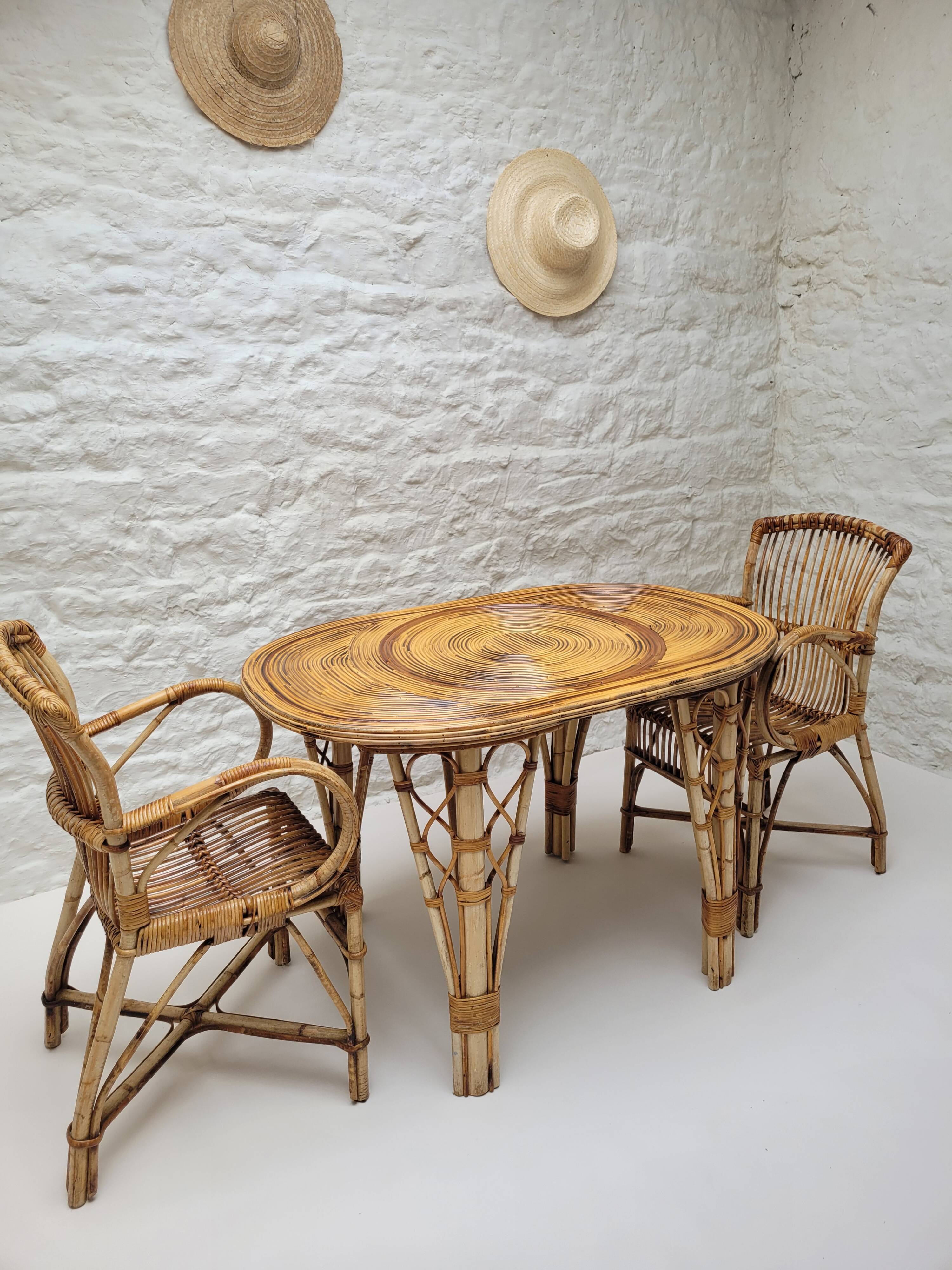 Vintage Audoux Minet bamboo, rattan, and smoked glass table duo.