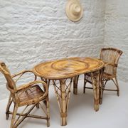 Vintage Audoux Minet bamboo, rattan, and smoked glass table duo.