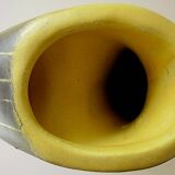 Earthenware vase decorated with yellow lines on a black and yellow background