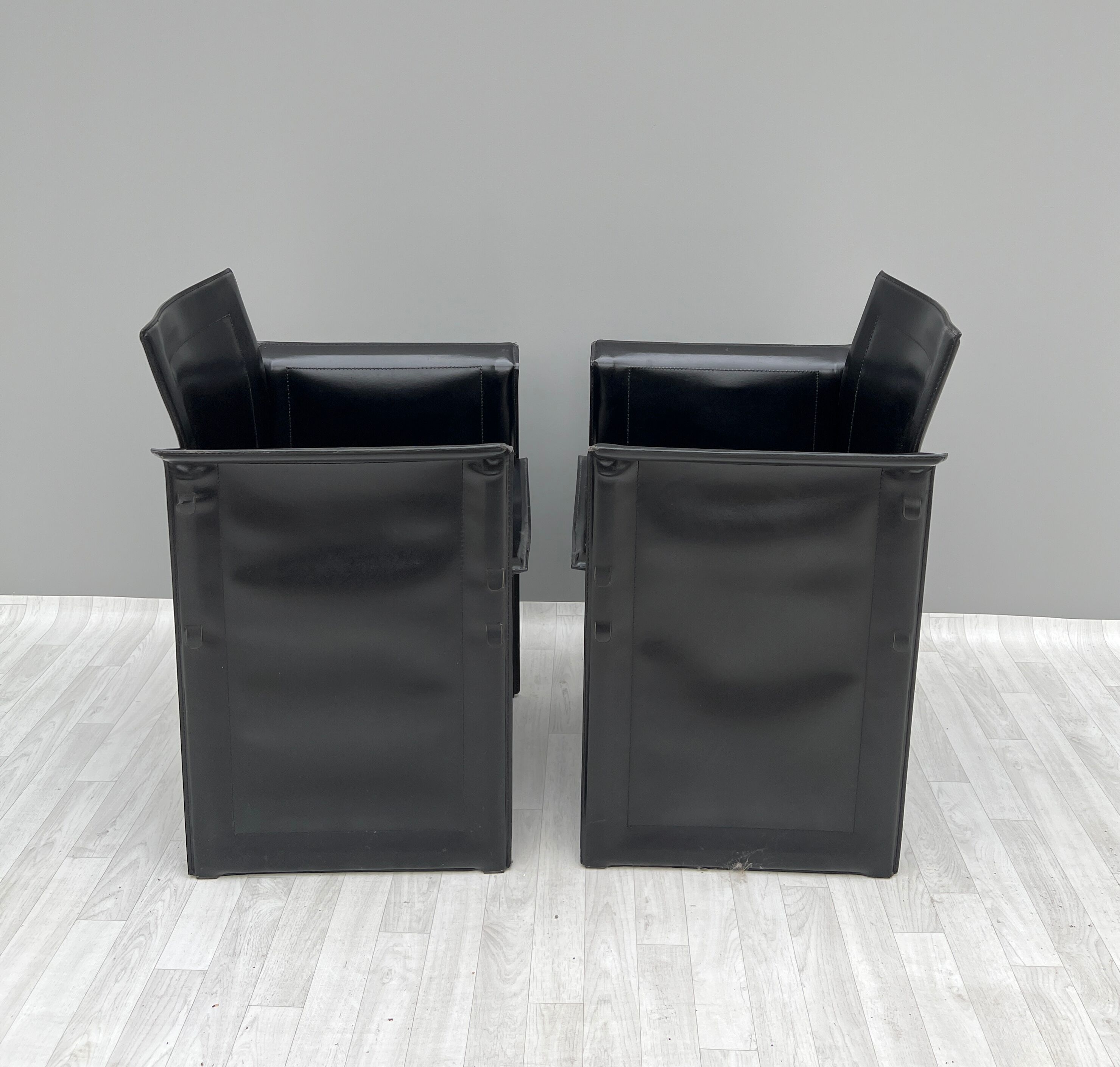 Pair of armchairs in black leather