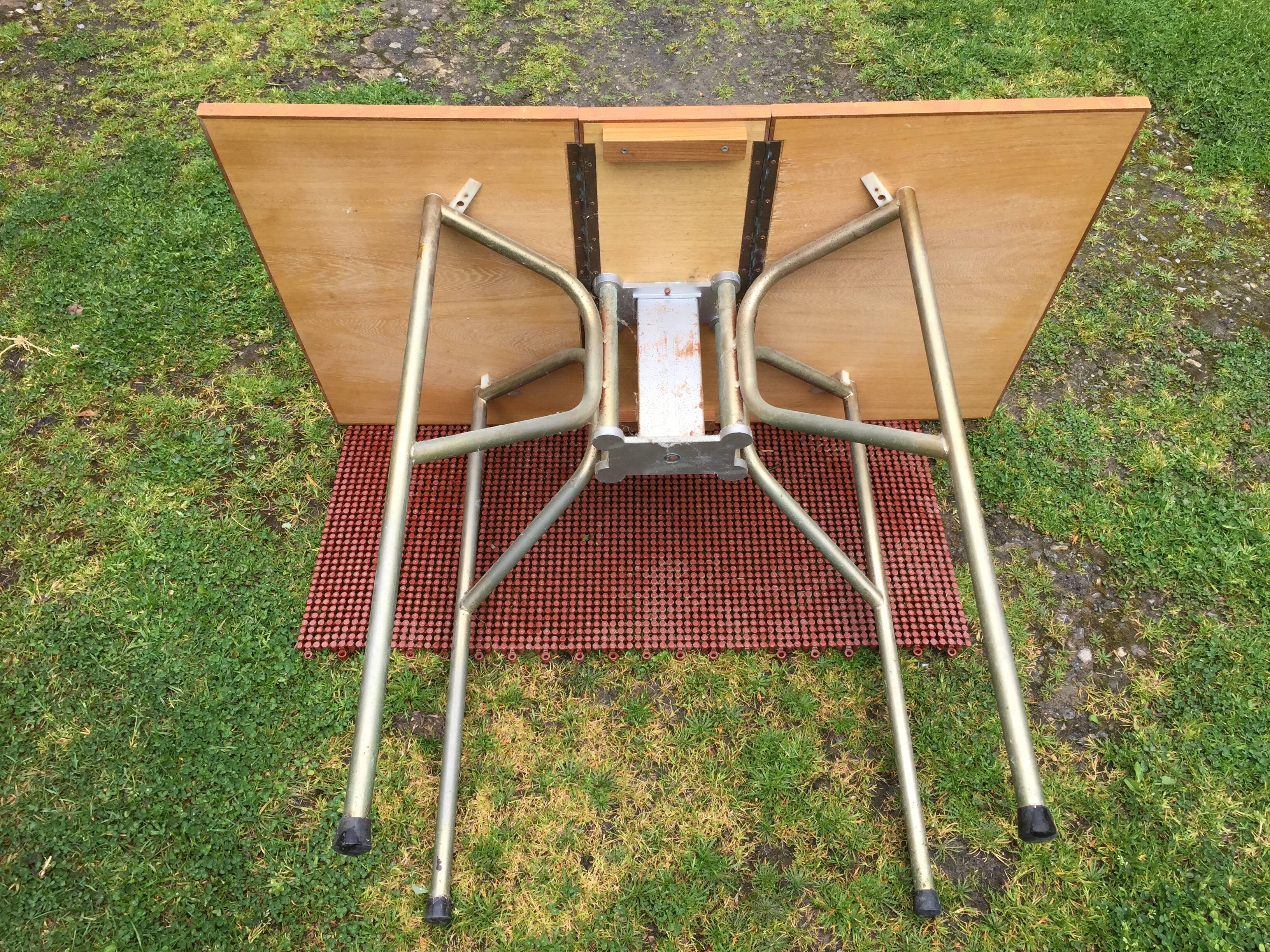 Vintage folding table with teak flaps said wallet with metal tubular base