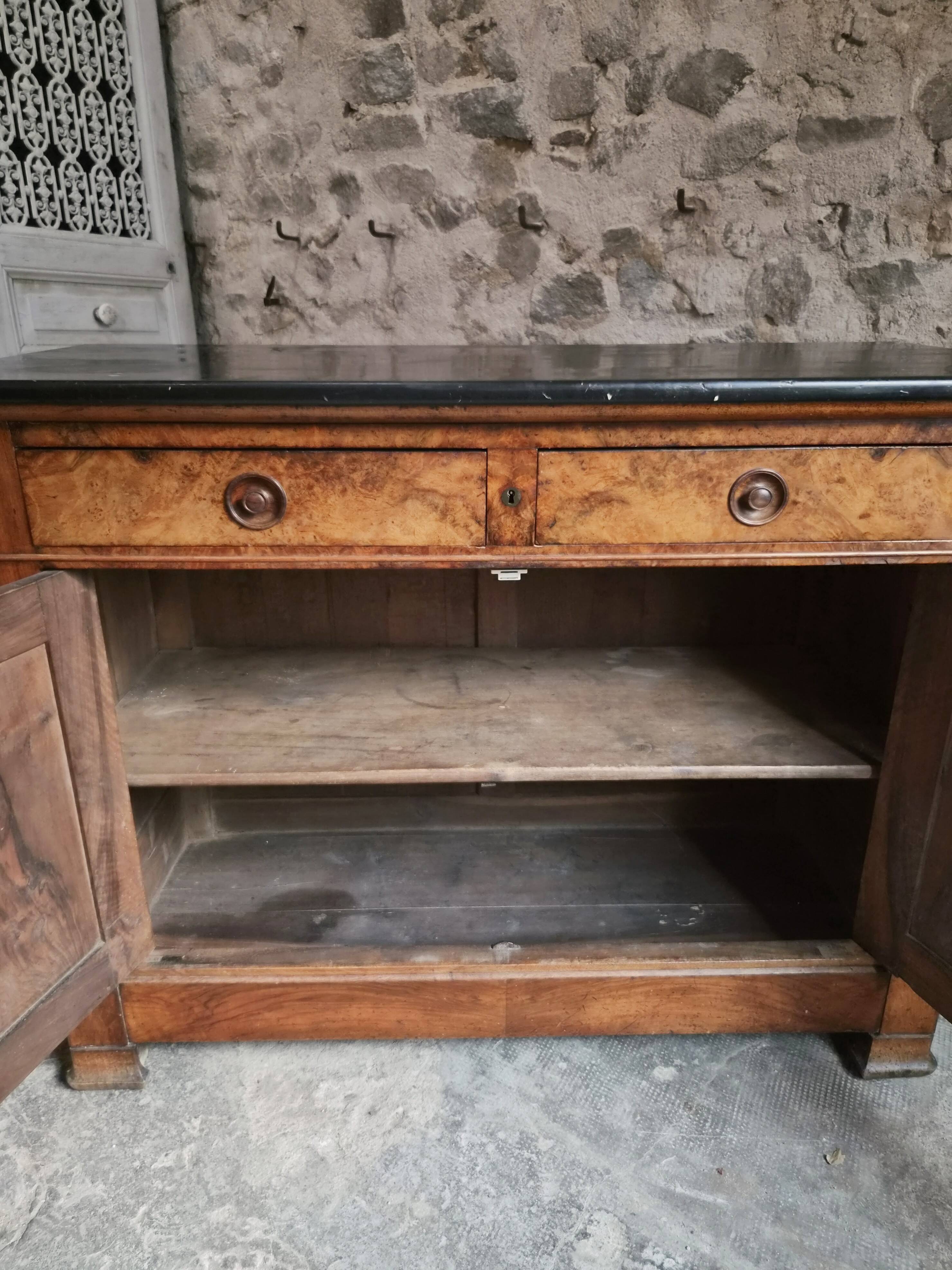 French Louis Philippe walnut buffet with black marble top, France, circa 1840–1860.