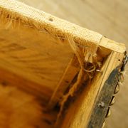Old-curved wooden trunk - burlap