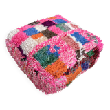 Berber floor pouf: Handwoven Moroccan wool cushion.