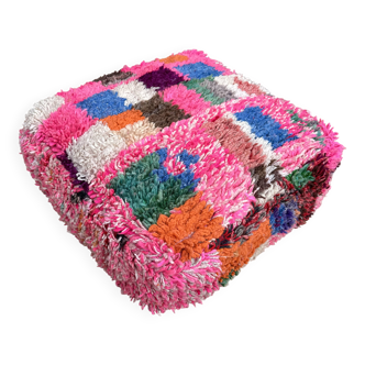 Berber floor pouf: Handwoven Moroccan wool cushion.