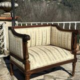Low armchair in finely carved wood in the Louis XVI style from the 19th century