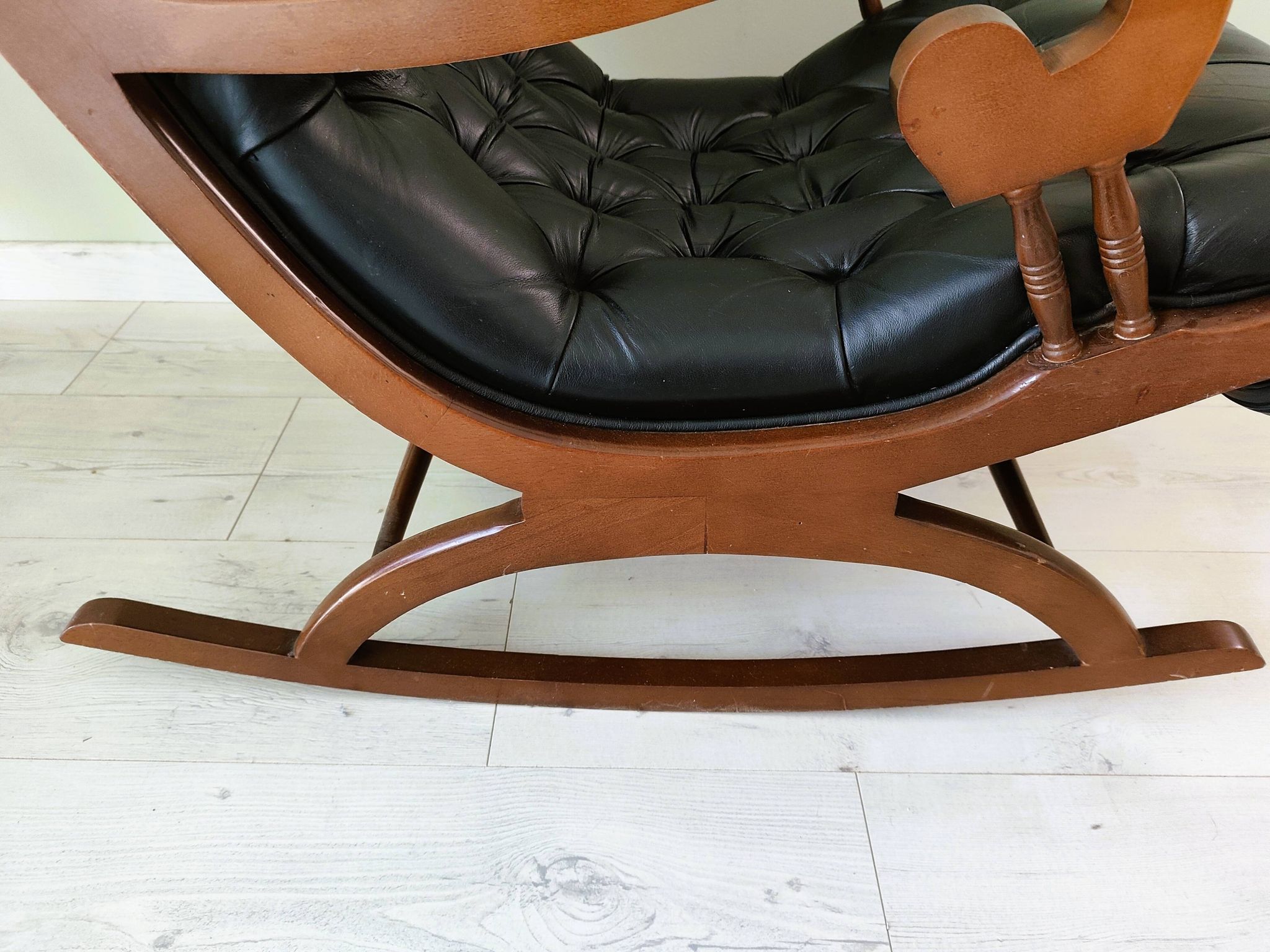 Black leather rocking Chesterfield armchair