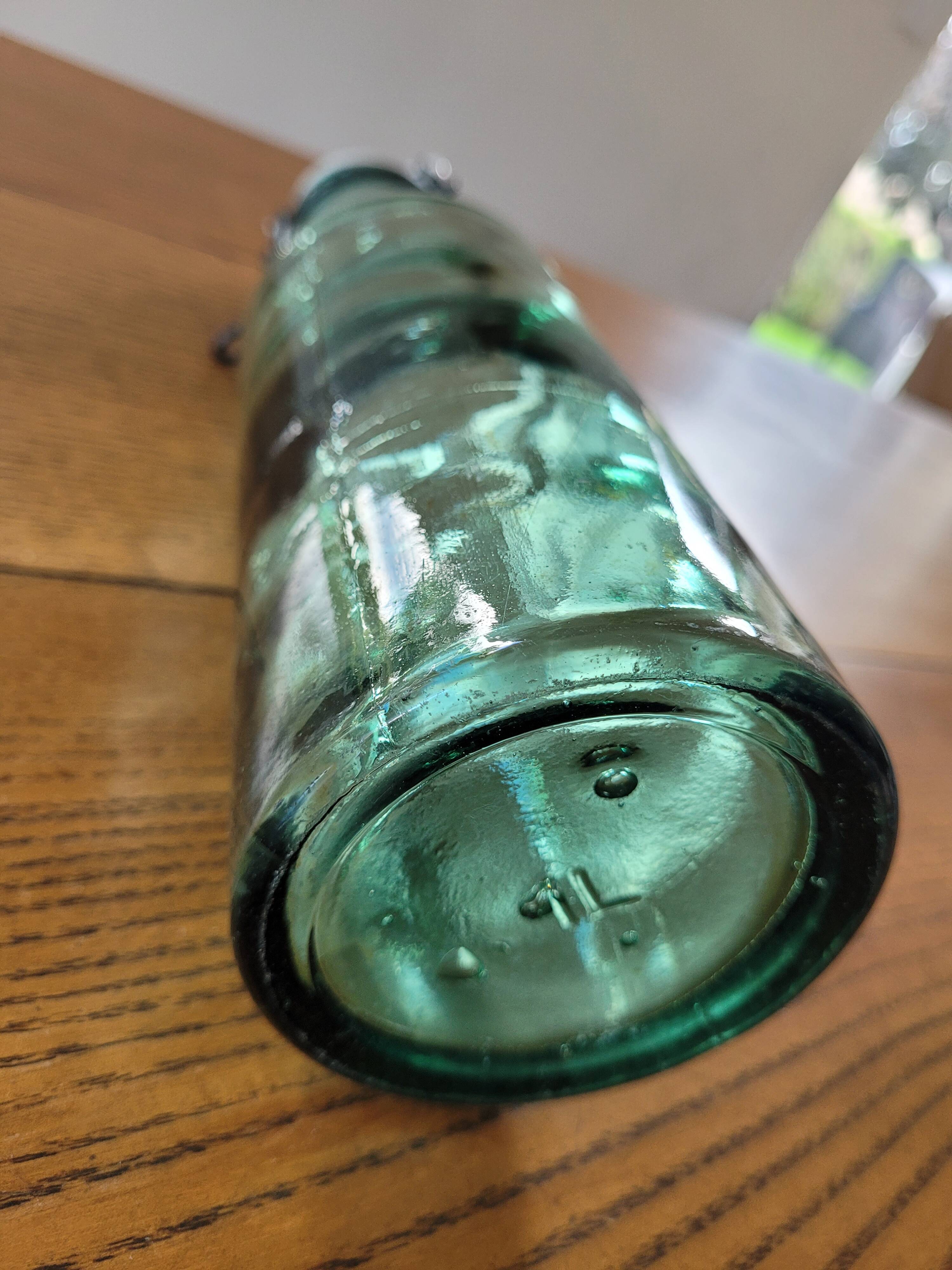 Vintage glass bottle l'Idéale with porcelain stopper