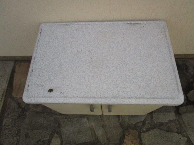 Old storage furniture in sheet metal and enamelled sheet metal