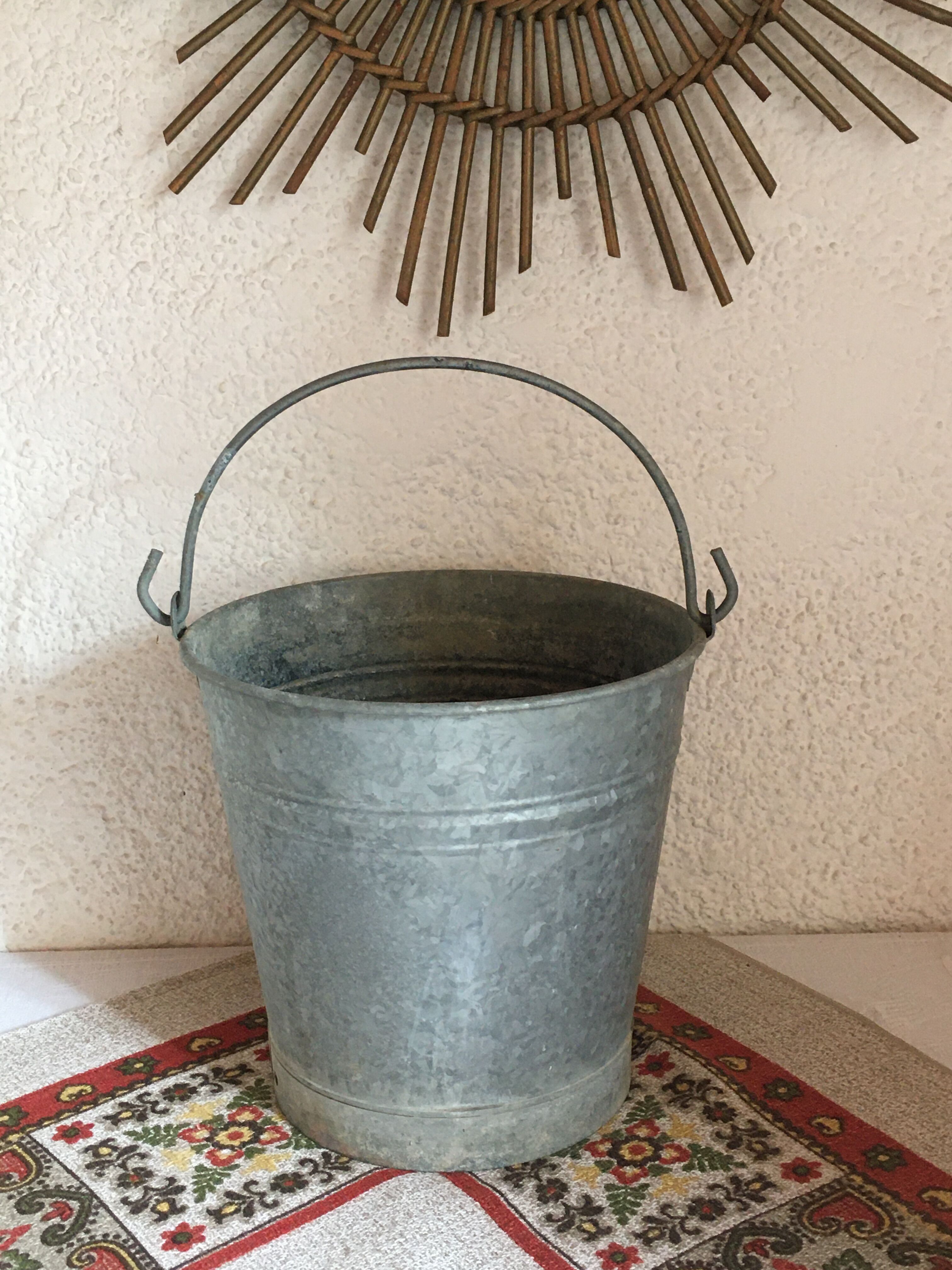 Old bucket in vintage zinc pot cache